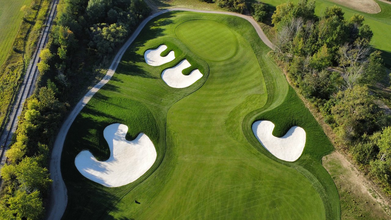 Beautiful golf course with bunkers.